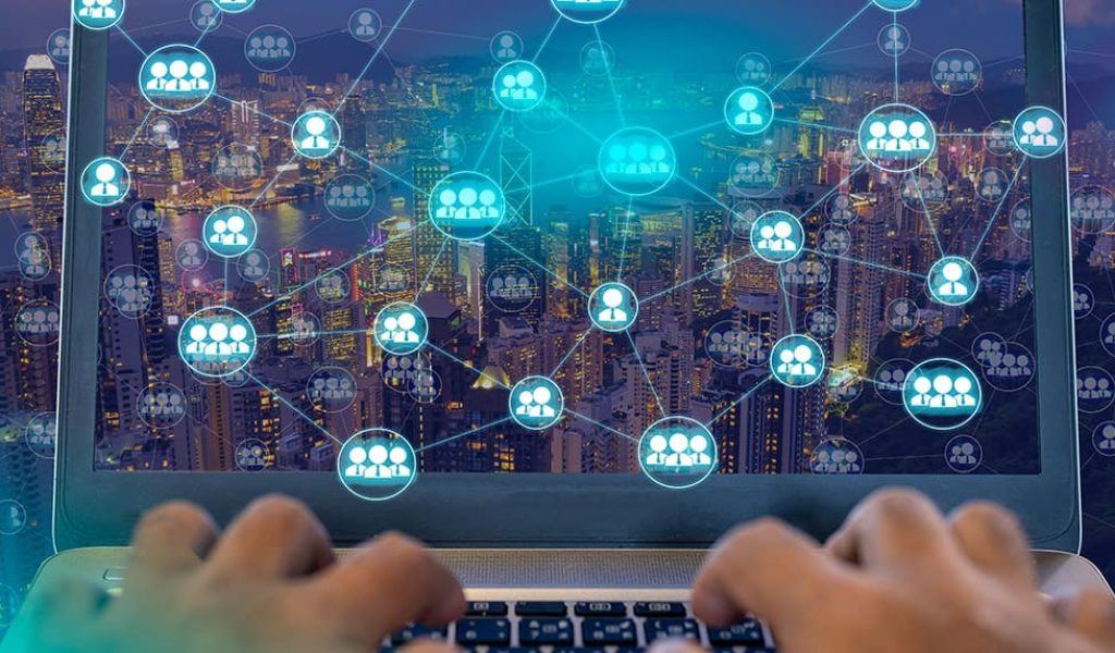 people-using-laptop-connect-with-other-person-with-wireless-networking-diagram-cityscape-night-that-represent-internet-communication-worldwild