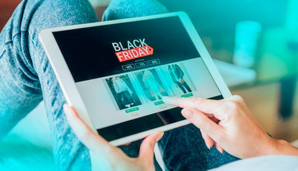 young-woman-holding-digital-tablet-shopping-online-black-friday-home