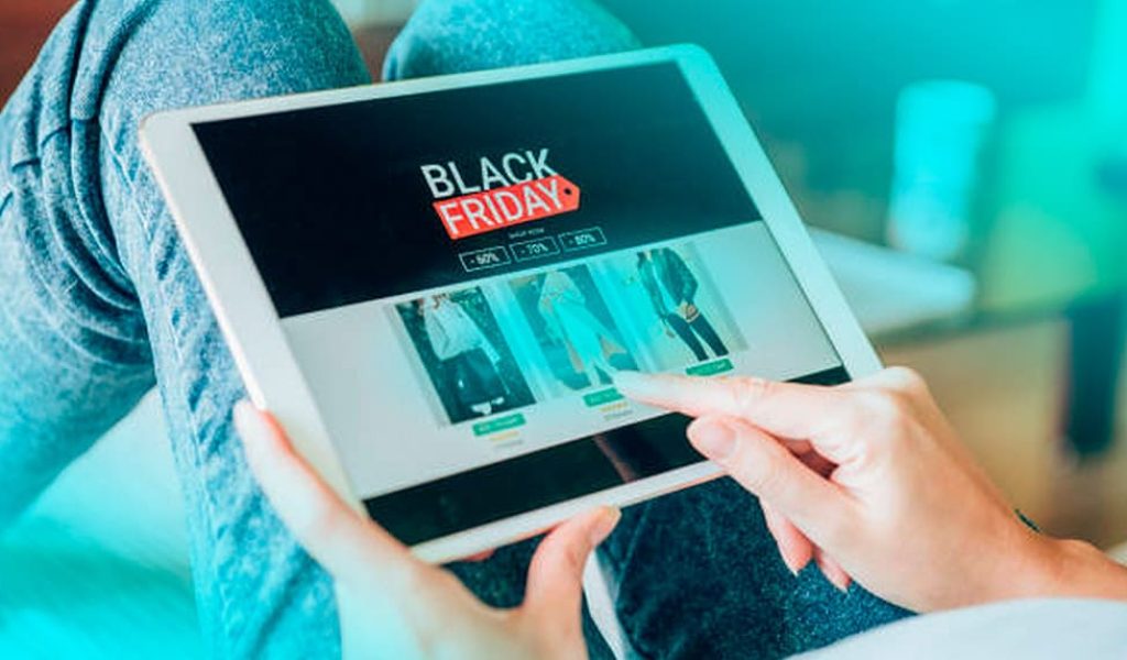 young-woman-holding-digital-tablet-shopping-online-black-friday-home